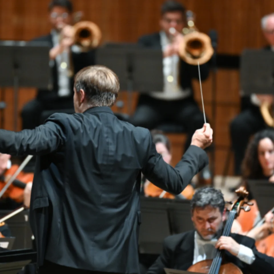 Conductor conducting an orchestra
